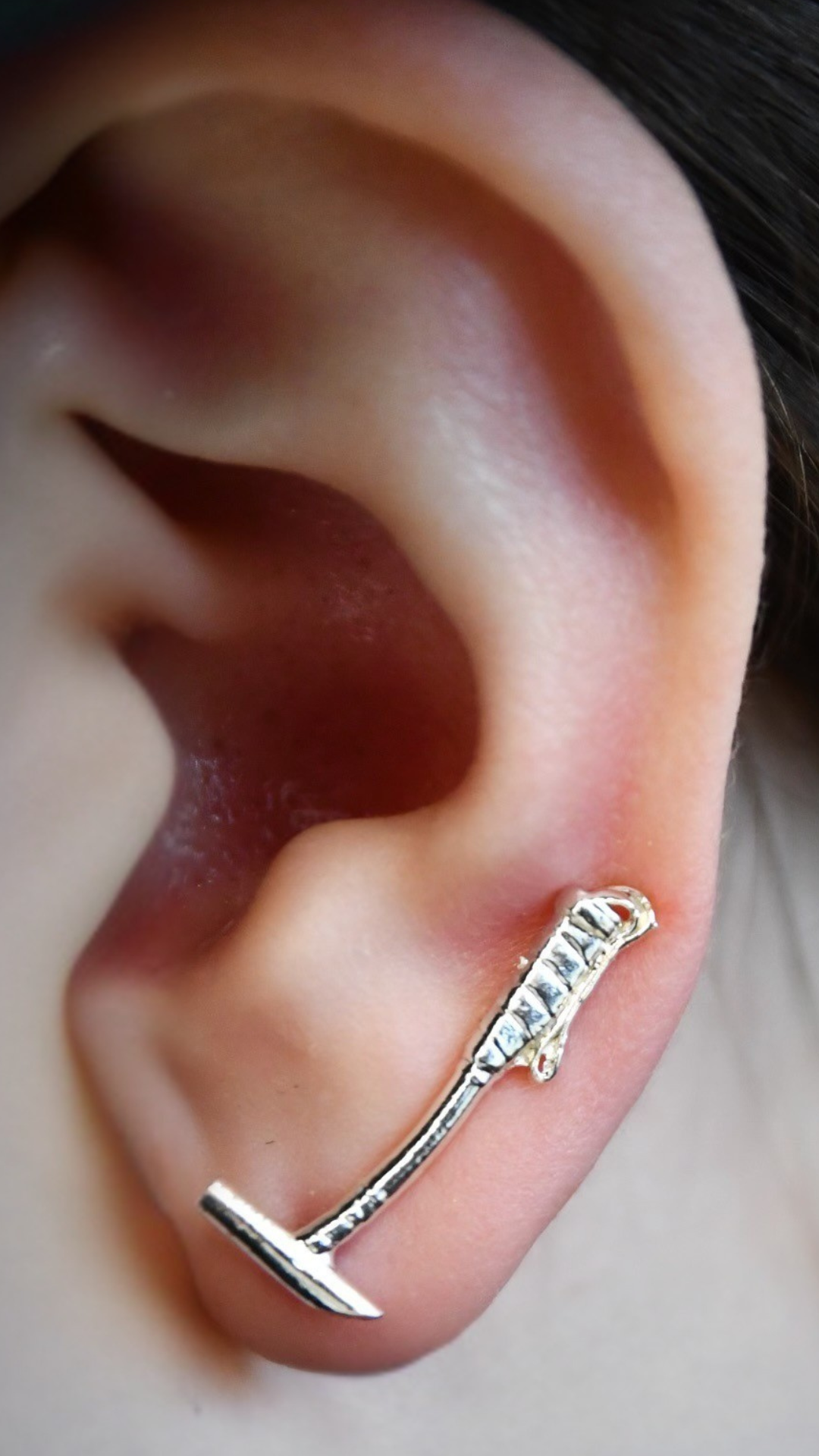 Sterling silver polo mallet earring climber worn on ear, styled vertically along the earlobe — handcrafted jewelry for women in polo or equestrian sport.